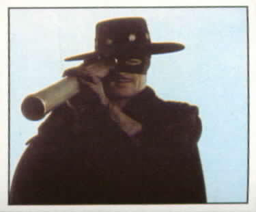 #57 Zorro uses a spyglass to look for the dead man.
