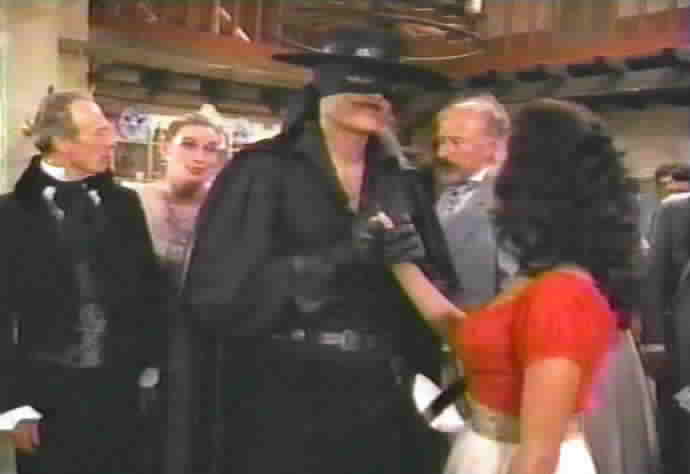 Zorro kisses Victoria's hand.