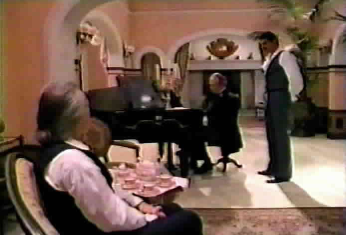 Don Alejandro and Diego listen as Aragon plays the piano.